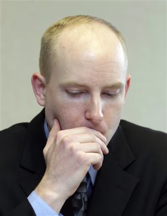 Nathan Nicholson speaks to reporters during an interview on Tuesday in Portland, Ore. A federal judge on Tuesday sentenced the son of an imprisoned spy to five years of probation for helping his father contact his old Russian handlers in a scheme to collect money from them while behind bars. Nicholson, son of ex-CIA agent Harold "Jim" Nicholson, had pleaded guilty to a pair of conspiracy charges and could have faced a prison term.(AP Photo/Rick Bowmer)